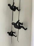 Love These Climbing Men- Wall Art (global Views; Solid Cast Iron). Fixed Price $72.99.