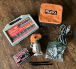 Ridgid Compact Fixed Base Corded Router, R2401, Extra Bits Shown, Used. Fixed Price $136.50.